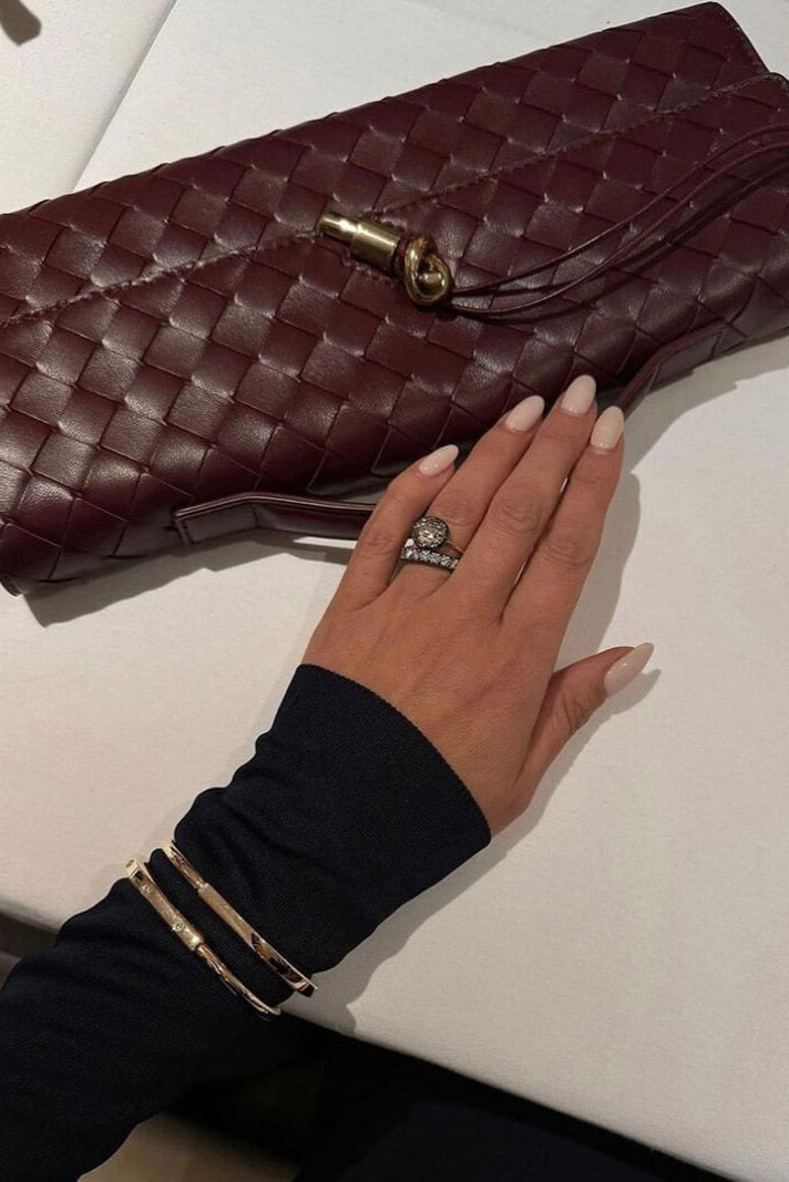Melanie | Cartera de mano con lazo dorado
